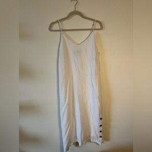 White dress with buttons on the side